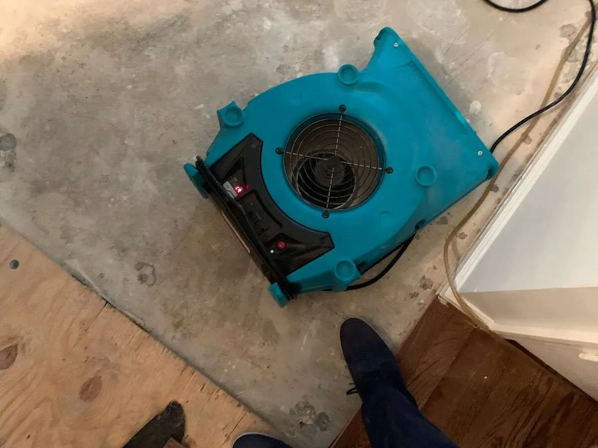 Air mover drying subfloor during Leak Detection & Repair in Jupiter