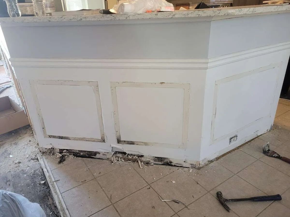 Water damage and mold on kitchen during Sewage Cleanup & Sanitation in Jupiter